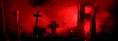 gif of a graveyard. red smoke moves from side to side behind the graves.